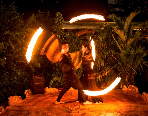 Thumbuakar fire performers at Night Safari, Singapore Zoo.