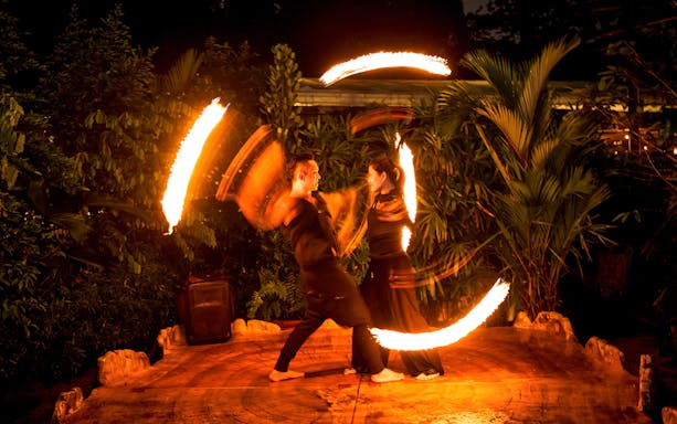 Thumbuakar fire performers at Night Safari, Singapore Zoo.