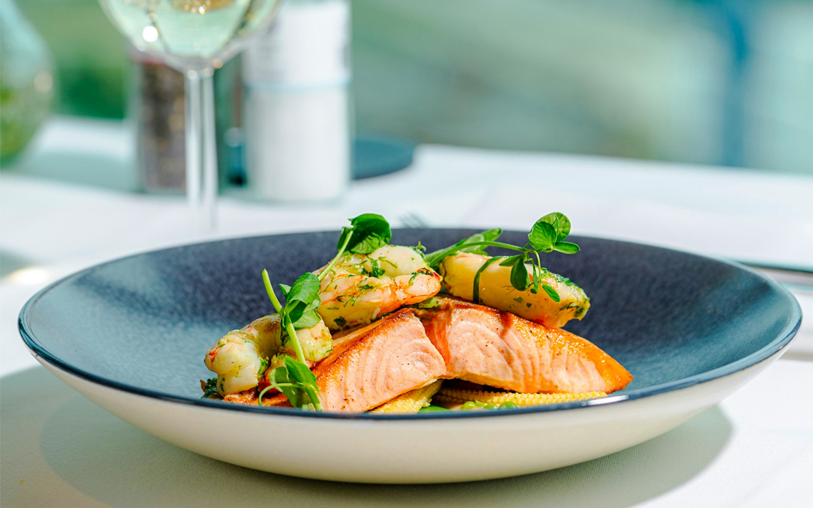 Salmon and shrimp dish served at Euromast dining experience.