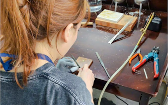Jewelry making tools and instructor at a workshop in Da Nang.