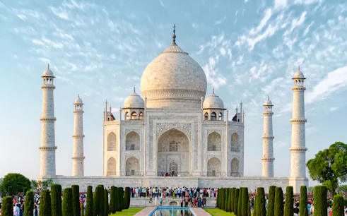 Taj Mahal with visitors, Agra, India, viewed from the gardens on a clear day.