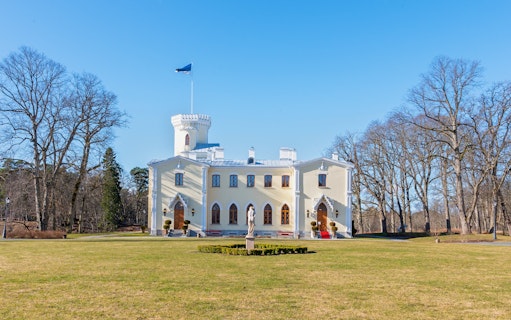 Keila-Joa Manor in Estonia with a central tower and surrounding trees.