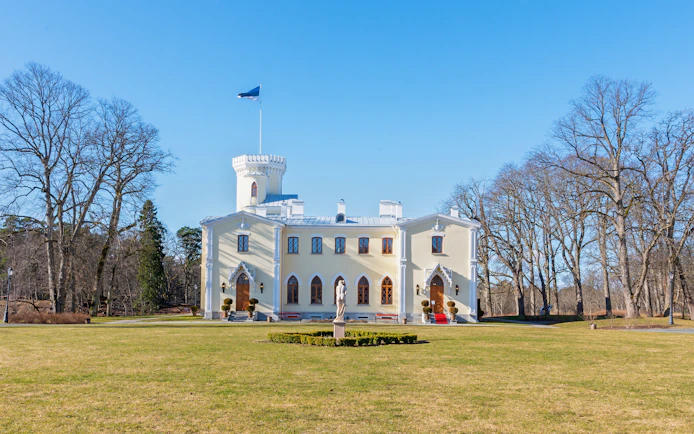 Keila-Joa Manor in Estonia with a central tower and surrounding trees.