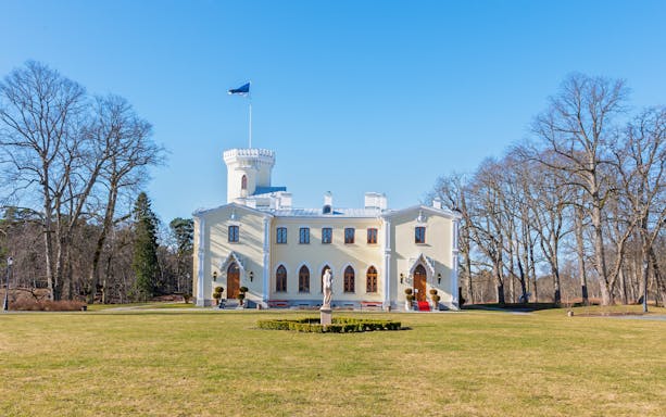 Keila-Joa Manor in Estonia with a central tower and surrounding trees.