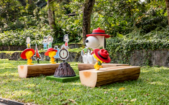 Snoopy and Beagle Scouts display at Singapore Zoo with forest backdrop.