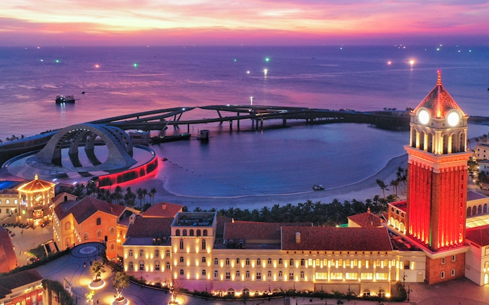 Sunset view of An Thoi Town with the world's longest seacrossing cable car system to Hon Thom Island.