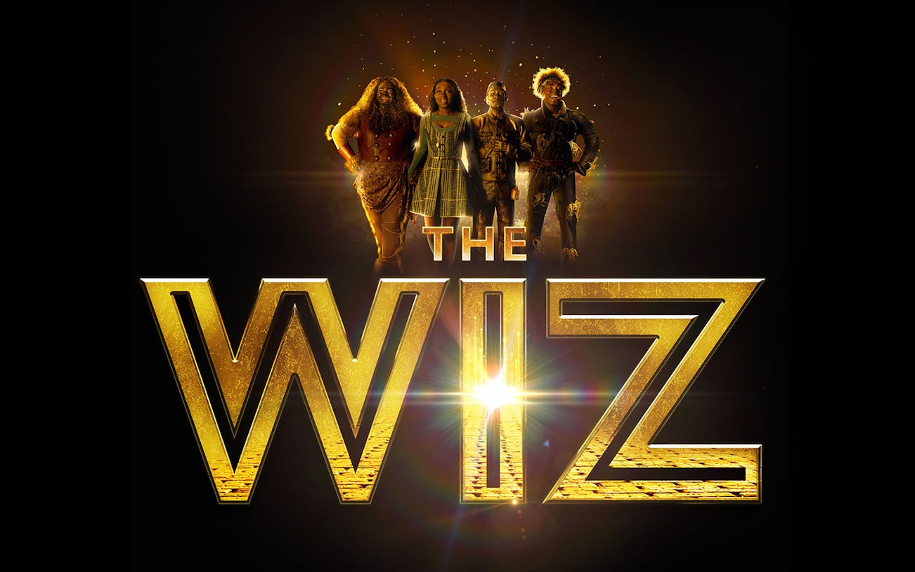 The Wiz musical poster with four characters standing above the title.