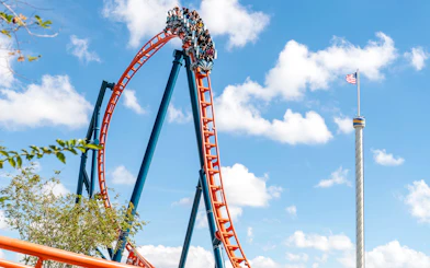 Ice Breaker roller coaster at SeaWorld Orlando with riders on a steep drop.