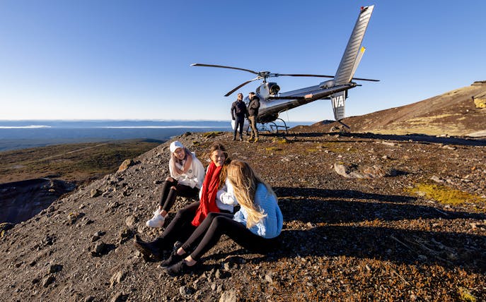 Helicopter tour group on White Island with Mount Tarawera in the background.