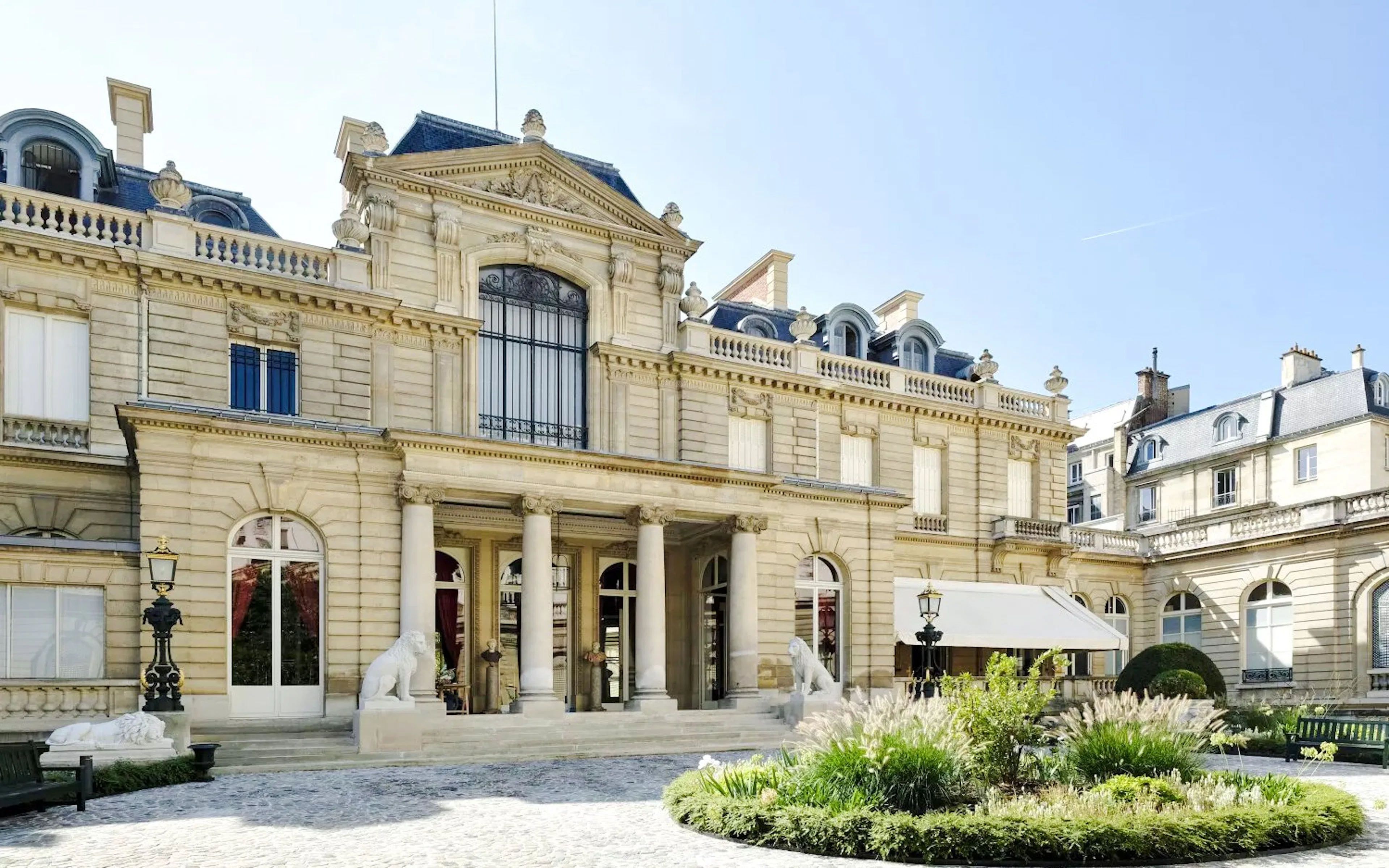 Jacquemart André Museum exterior with ornate architecture and garden in Paris.