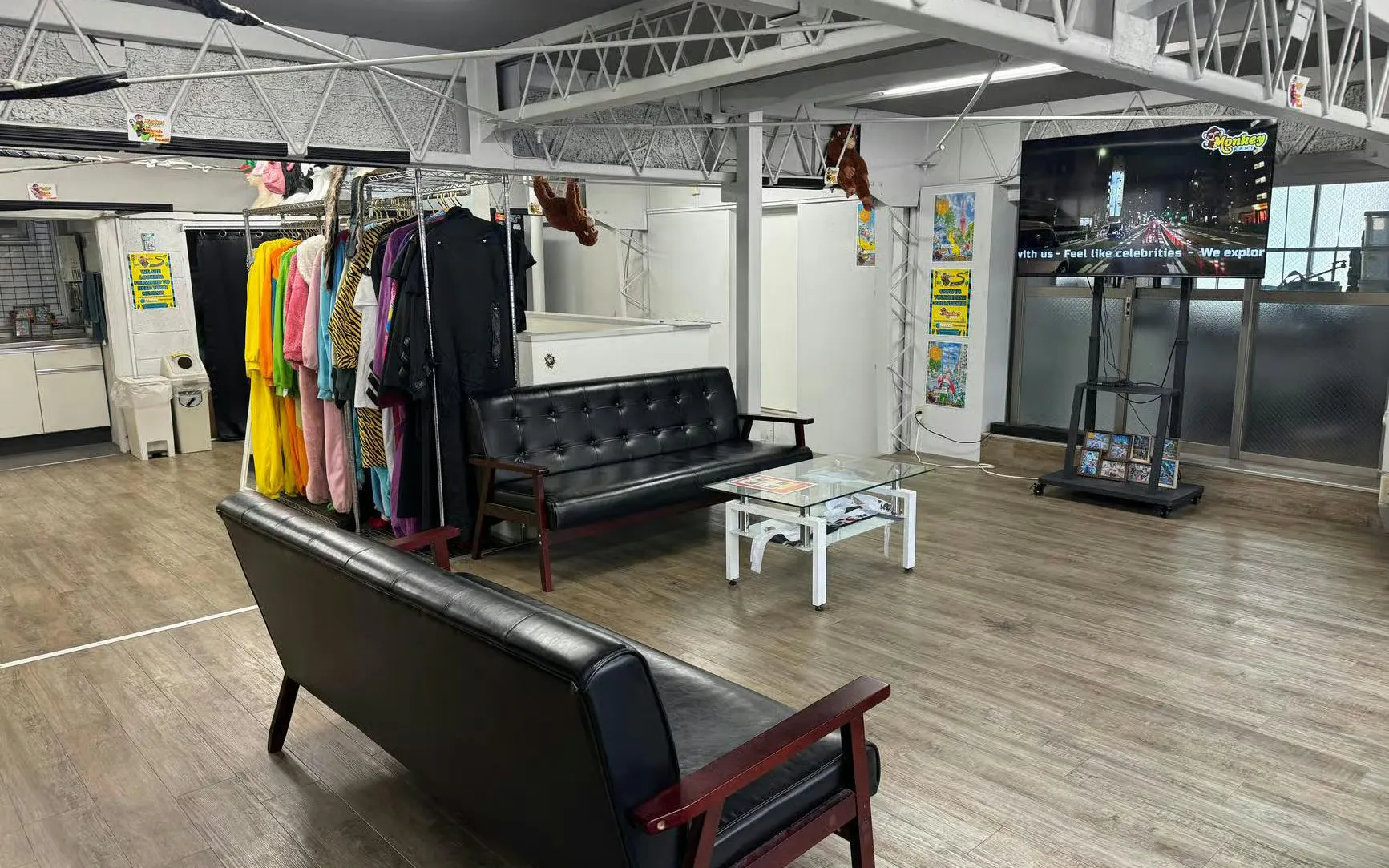 Go-karting gear room with costumes and seating area for Shibuya Crossing & Tokyo Tower tour.