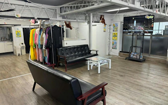 Go-karting gear room with costumes and seating area for Shibuya Crossing & Tokyo Tower tour.