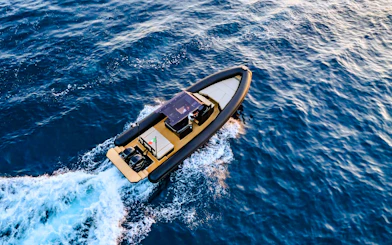 RIB boat cruising through the waters of La Maddalena Archipelago.