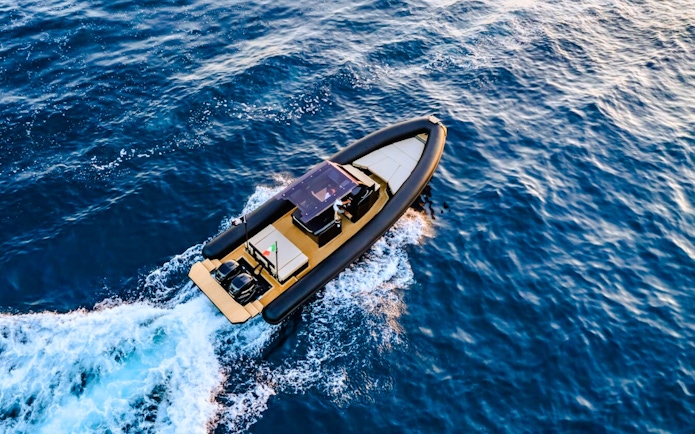 RIB boat cruising through the waters of La Maddalena Archipelago.