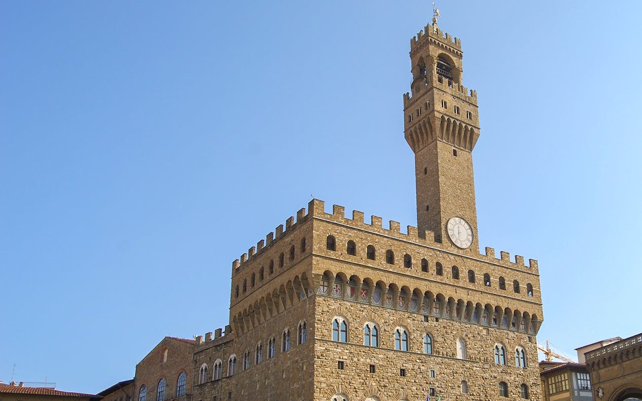 Palazzo Vecchio tower in Florence on a clear day.