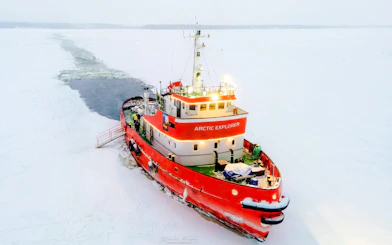 Icebreaker cruise ship navigating through frozen sea during Icebreaker Cruise & Ice Floating Experience.