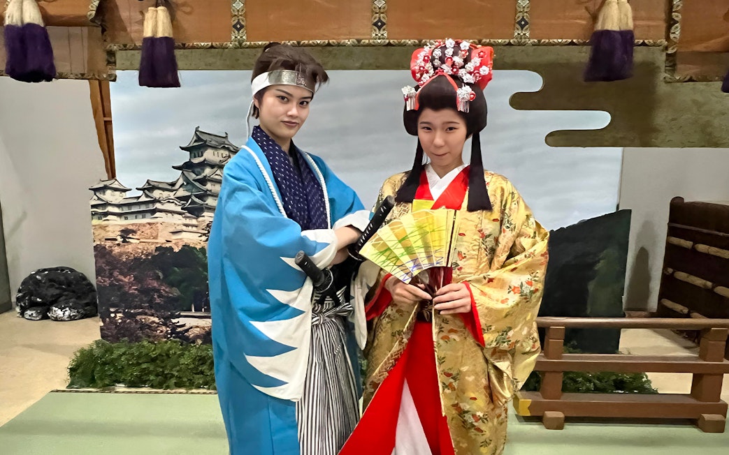 Samurai and geisha in traditional attire at TOEI Kyoto Studio Park.