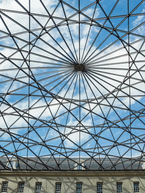 Skylight view inside The Maritime Museum, Amsterdam, showcasing geometric glass roof.
