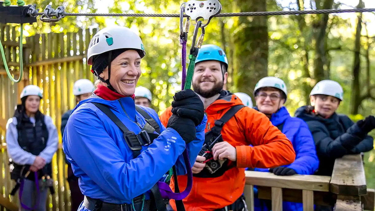 Participants preparing for Rotorua Forest zipline tour in safety gear.