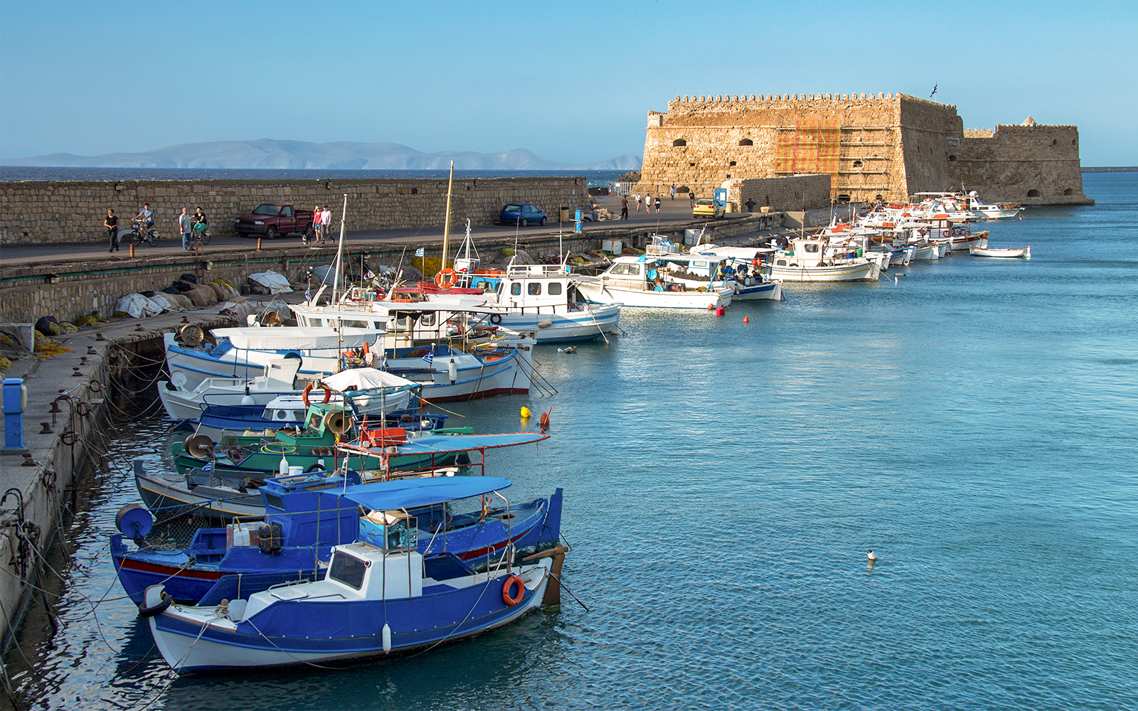 Heraklion ferry transfer with passengers boarding at the port in Crete, Greece.