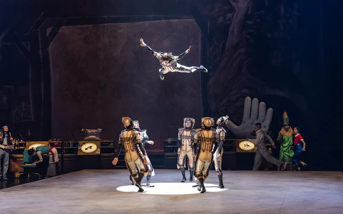 Performers in mid-air acrobatics during the "Drawn to Life" show.