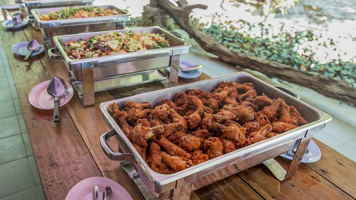 Buffet lunch with fried chicken and vegetable dishes on Surin Island day trip from Phuket.