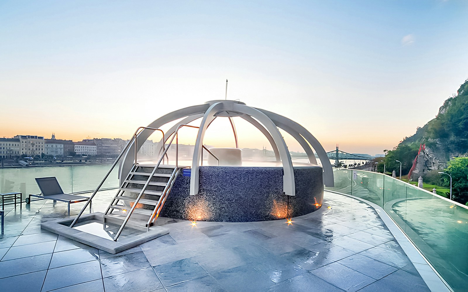 Rooftop pool at Rudas Baths with city and river view in Budapest.