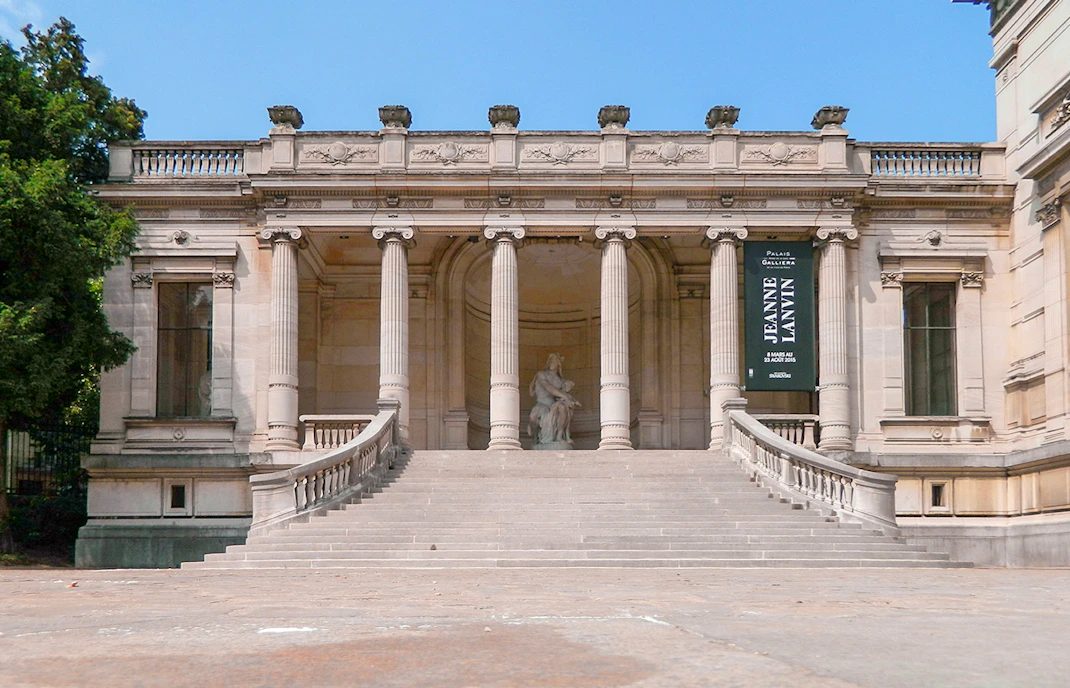 Palais Galliera exterior with grand staircase and columns in Paris, France.