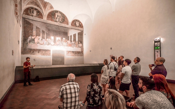 Tour group viewing the Last Supper painting in Milan's Santa Maria delle Grazie.