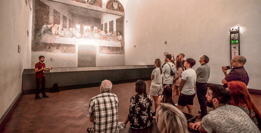 Tour group viewing the Last Supper painting in Milan's Santa Maria delle Grazie.