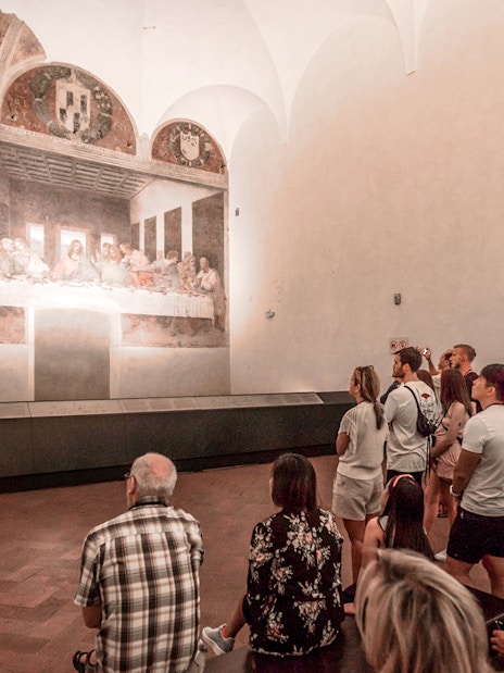 Tour group viewing the Last Supper painting in Milan's Santa Maria delle Grazie.