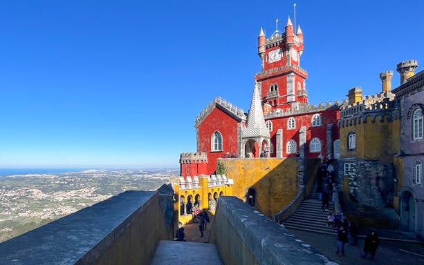Pena Palace in Sintra with colorful architecture and scenic views.