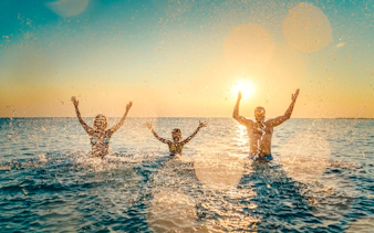 Group enjoying a swim in the Bosphorus at sunset during Istanbul cruise.