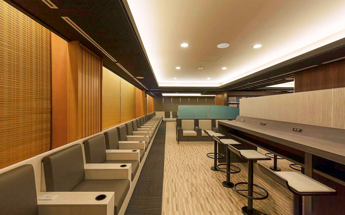 Waiting area seating at Narita International Airport Terminal 1 lounge.