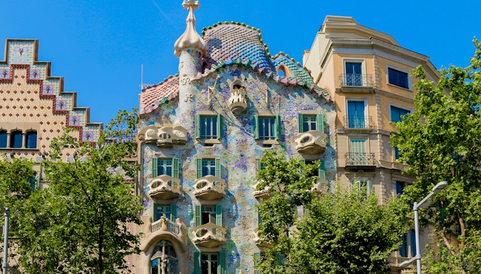 Casa Batlló facade with colorful mosaics and unique architecture in Barcelona, Spain.