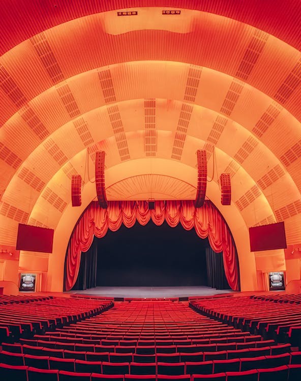 Interior view of Radio City Music Hall auditorium, New York, featuring stage and seating.