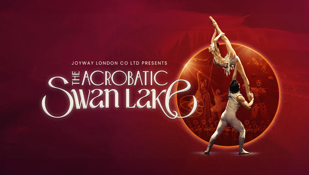 Acrobats performing Swan Lake with dramatic lift against a red backdrop.