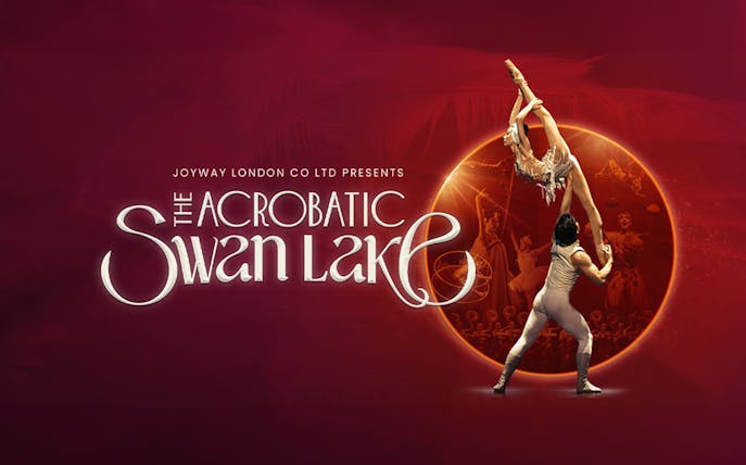 Acrobats performing Swan Lake with dramatic lift against a red backdrop.