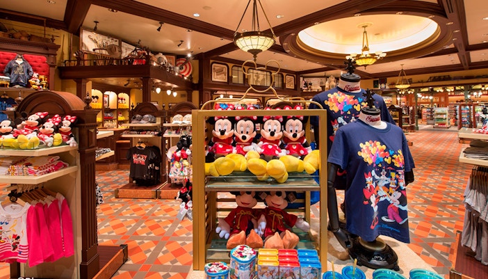 Plush toys and Disney merchandise in a gift shop at Hong Kong Disneyland.