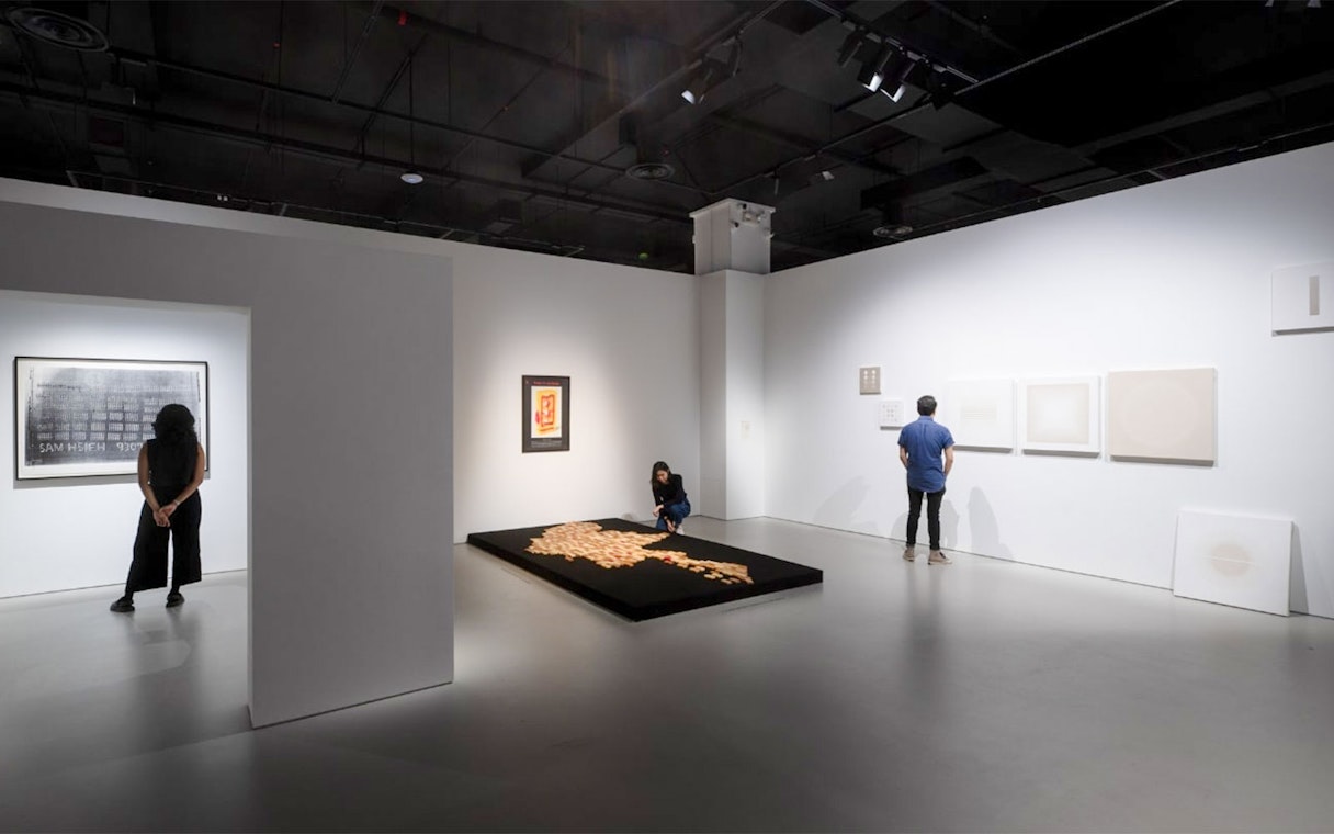 Visitors exploring exhibits at Singapore Art Museum.