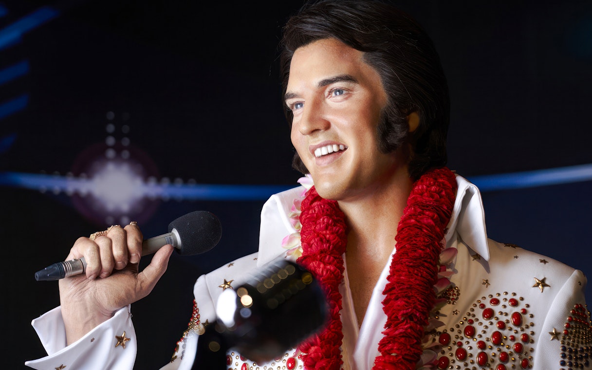 Wax figure of a singer holding a microphone at Madame Tussauds Tokyo.