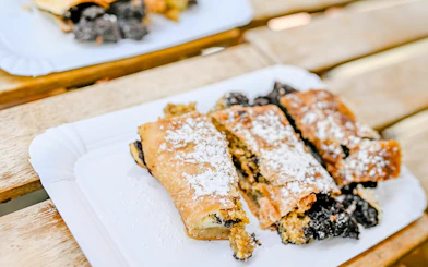 Czech pastry with poppy seeds on a plate during Prague food tour.