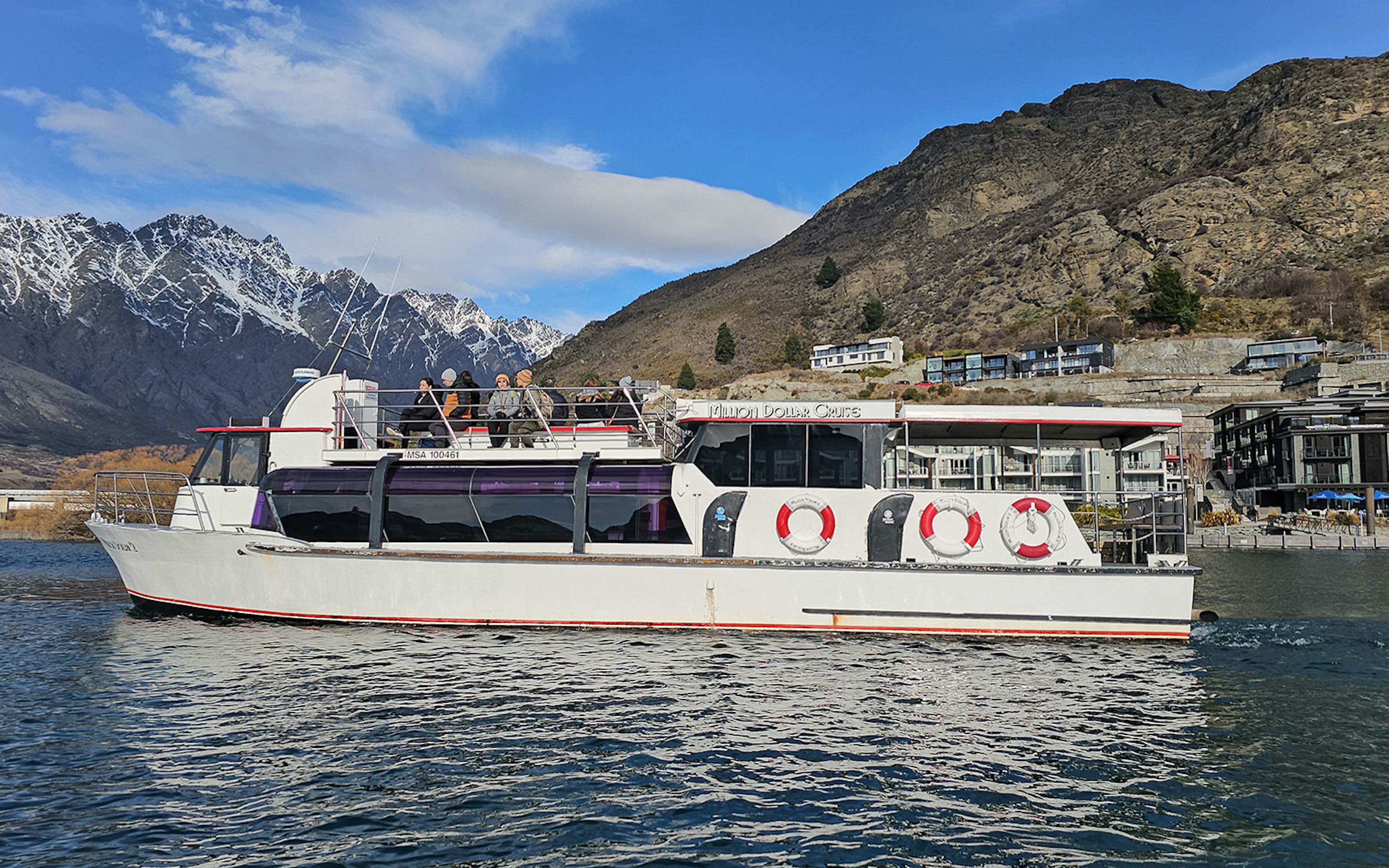 Lake Wakatipu cruise boat with scenic mountain views, Queenstown, New Zealand.