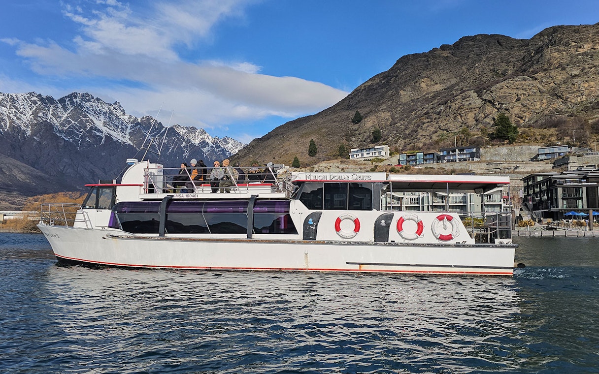 Lake Wakatipu cruise boat with scenic mountain views, Queenstown, New Zealand.