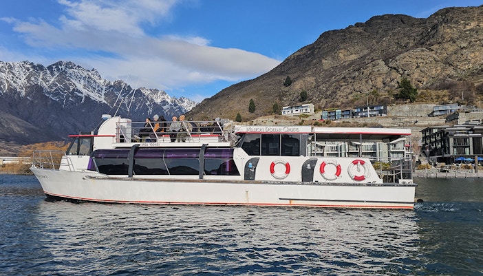 Lake Wakatipu cruise boat with scenic mountain views, Queenstown, New Zealand.