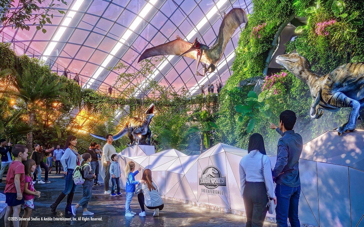 People exploring dinosaur exhibits at Jurassic World in Gardens by the Bay.