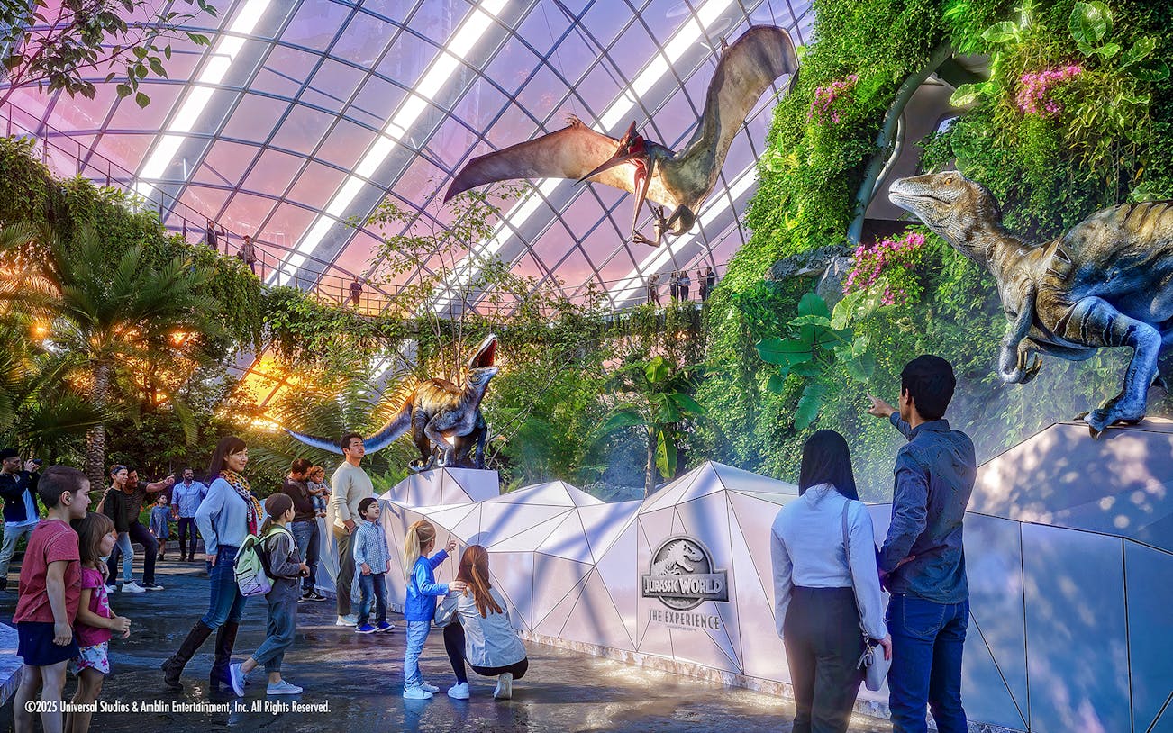 People exploring dinosaur exhibits at Jurassic World in Gardens by the Bay.