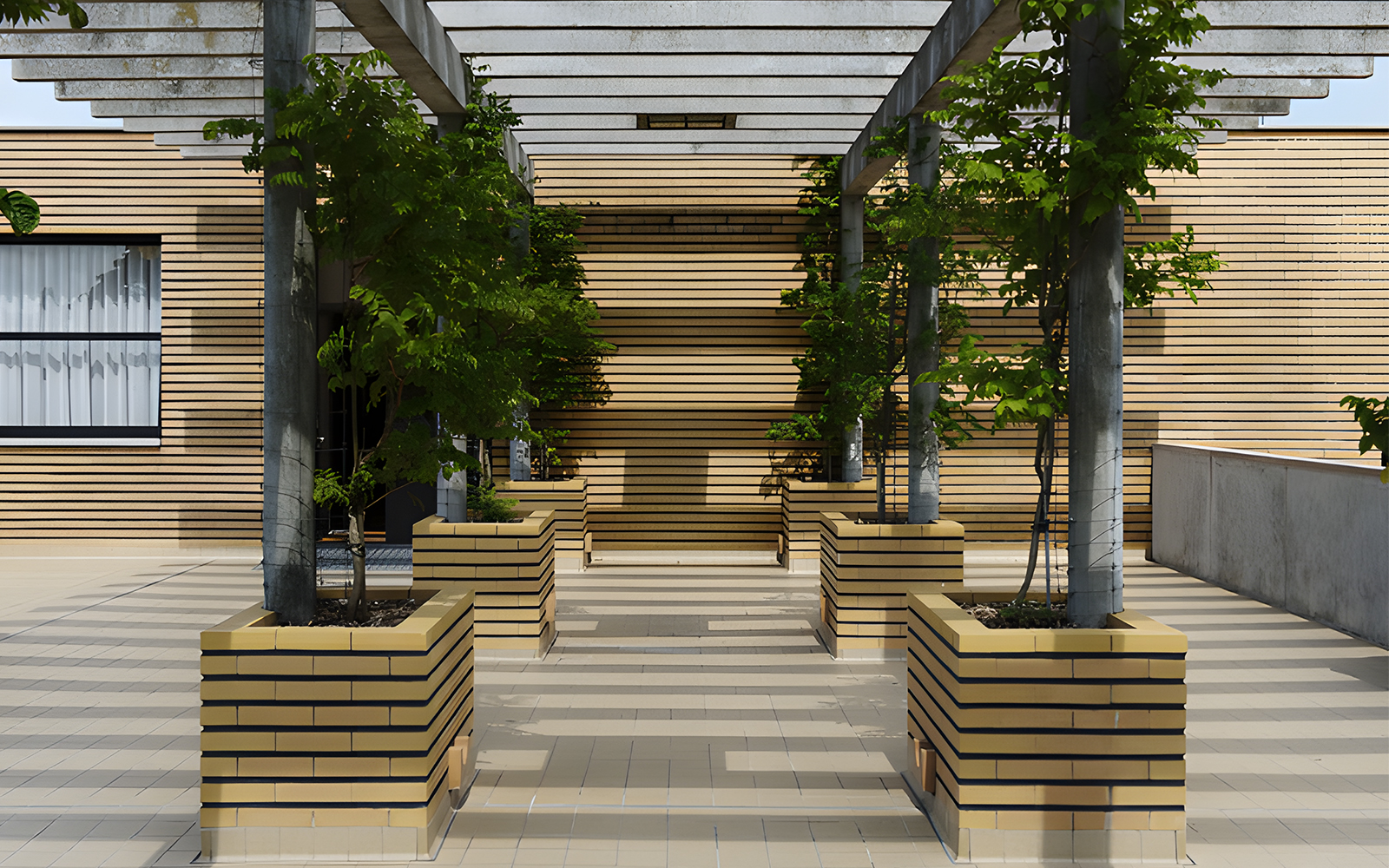 Villa Cavrois entrance with modern architecture and lined planters, France.