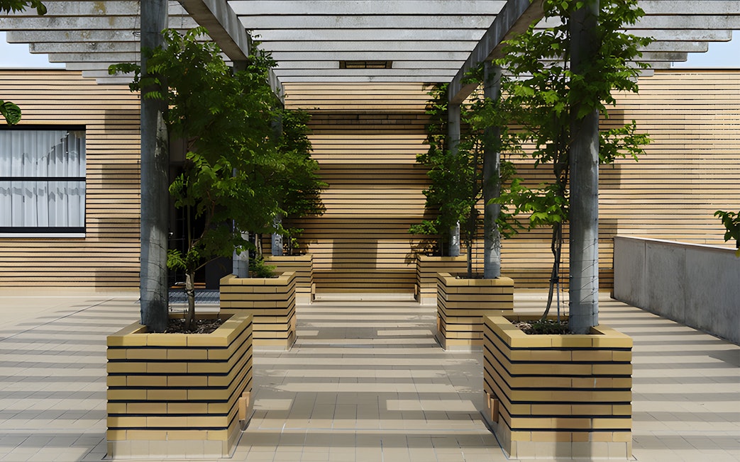 Villa Cavrois entrance with modern architecture and lined planters, France.