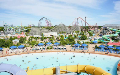 Water park with wave pool and slides at Hurricane Harbor Chicago.